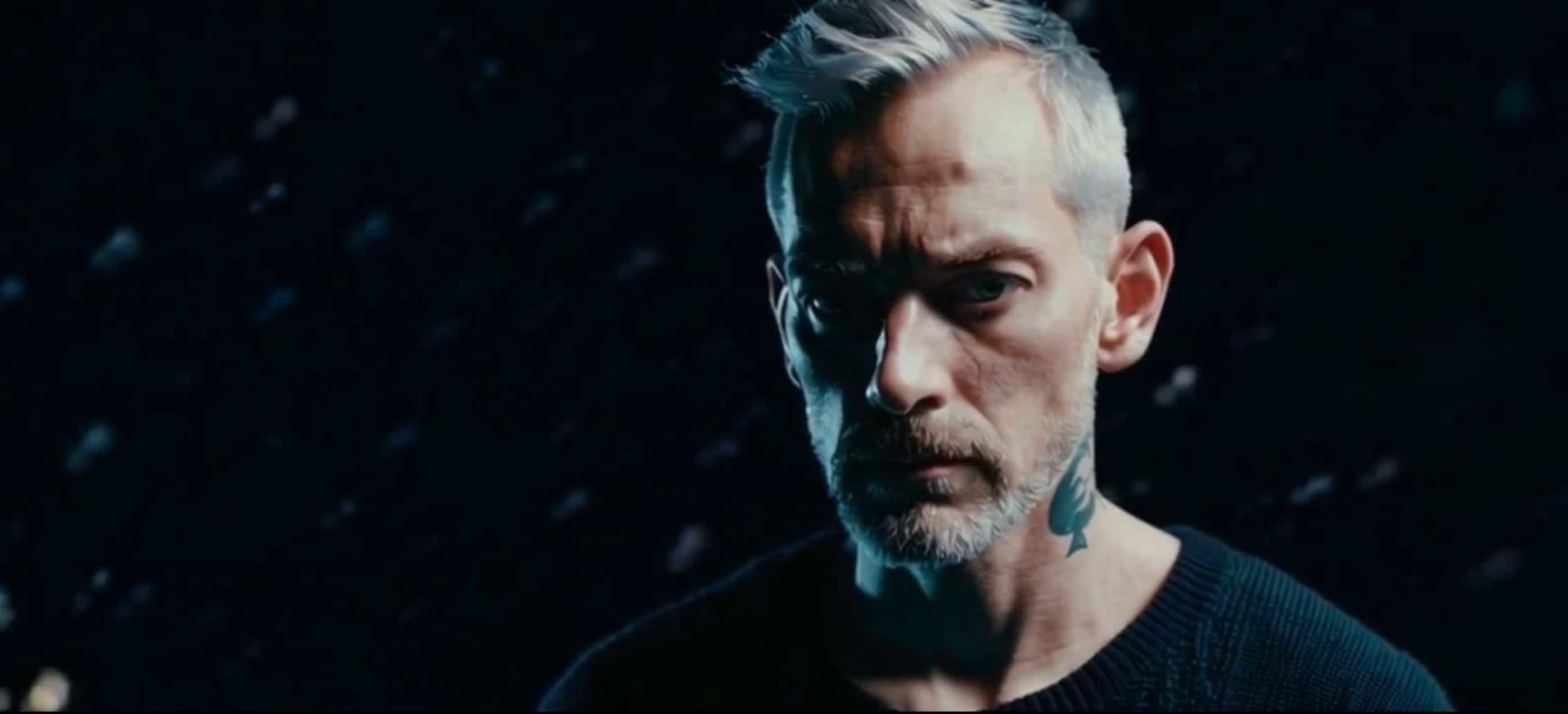 Low-key portrait of EgoB in blue light
